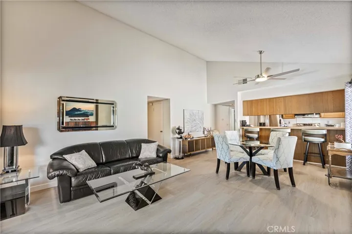 Super clean with natural light with neutral-toned vinyl flooring and open, airy feel.