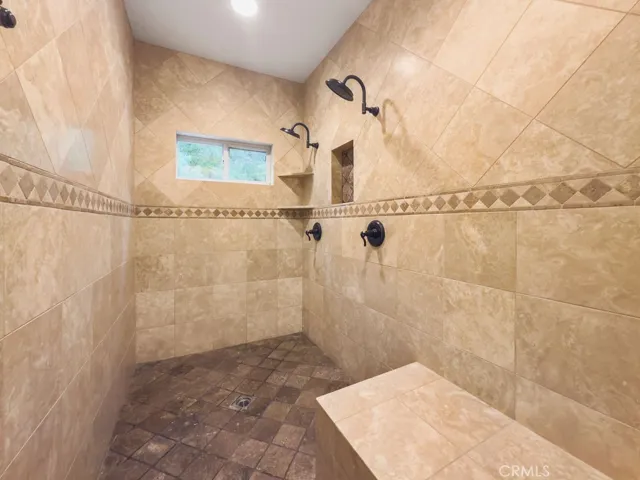 Gorgeous walk in stone tiled shower