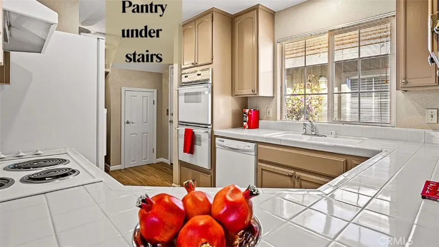 Pass through kitchen counter. Pantry under stairs
