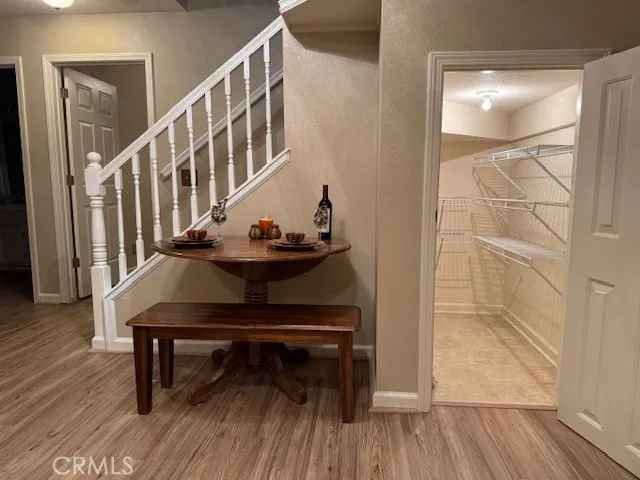 "L" shaped pantry under stairs