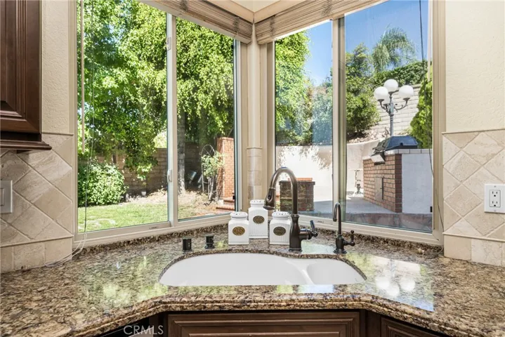 View of kitchen sink area and view to yard