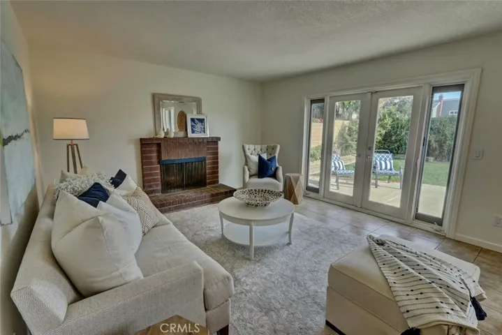 French doors to sunny rear yard to extend the entertainment space