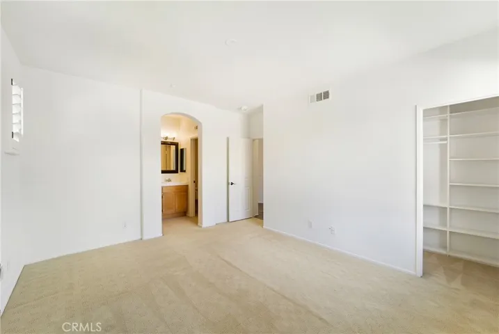 Walk in closet in the owner's suite.