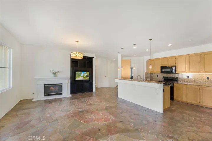 The living and dining rooms are filled with natural light.