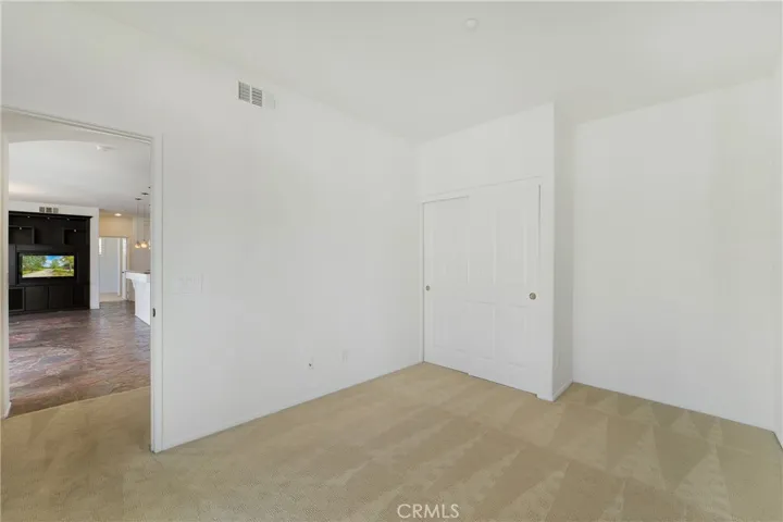 Secondary bedroom with full closet.
