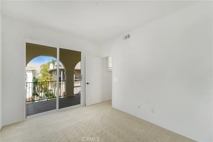 Separate balcony exit from the secondary bedroom.