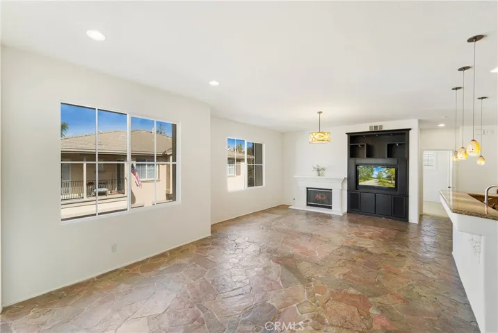 Custom built in entertainment center includes a flat screen TV!