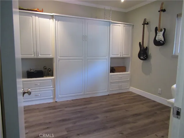 Beautiful custom shelves with Murphy Bed in the middle.