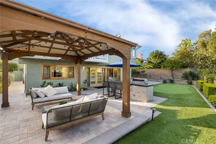 Appreciate the backyard where you can sit in the gazebo or practice your golf skills at the putting green