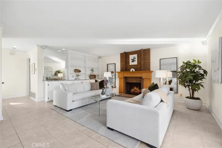 Cozy up in the living room, by the fireplace