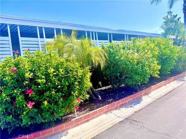 Side View of the property with  lots of fruit trees fruit trees and beautiful flowers