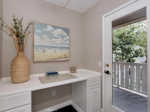 Builder upgrade with extra work space and additional covered deck with storage closet, unique to only 8 units in this complex.
