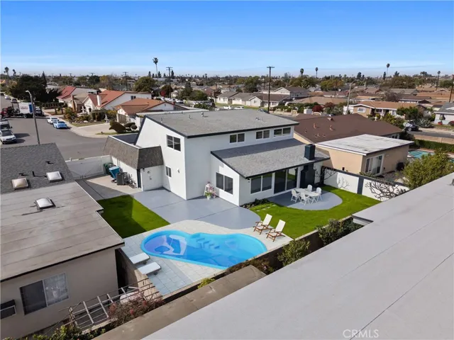 Backyard virtually staged with pool and furniture!