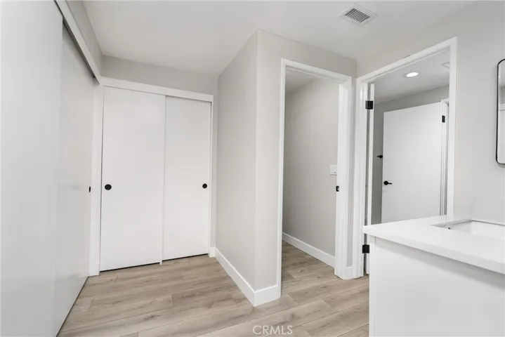 Plenty of storage with two closets and a door to the attic