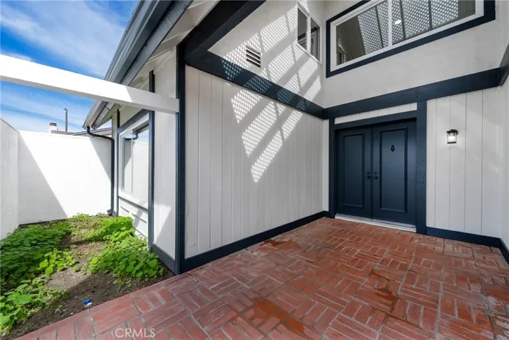 Gated and enclosed front courtyard with inlaid brick, making this an ideal location for outdoor enjoyment.