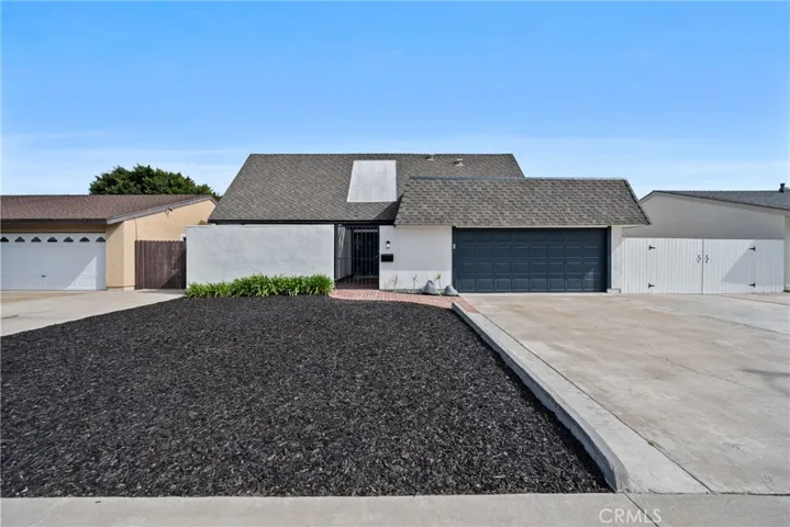 The pleasant curb appeal starts with the low maintenance front yard.