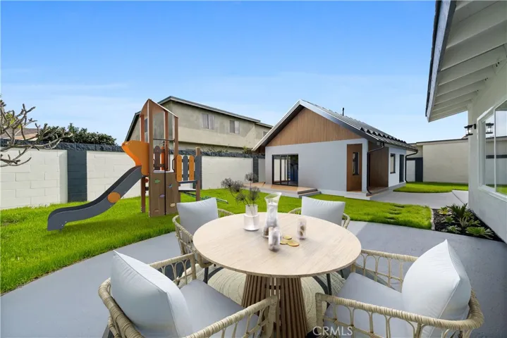 Backyard digitally rendered with an ADU and playground!