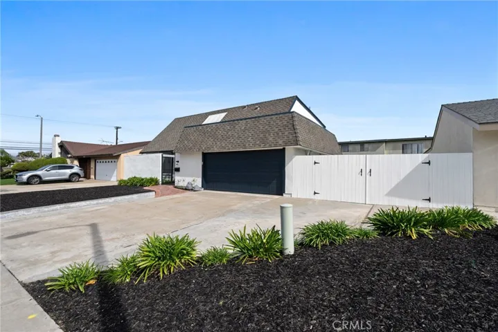Double wide gated concrete parking pad in the front and side of the house with room for an RV, boat and other toys!