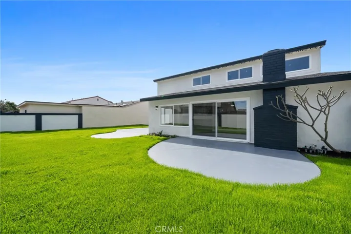 Already offering lush green grass, painted block walls, multiple patios areas with painted concrete.
