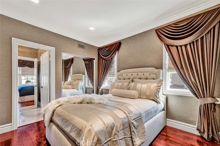The opposite view shows the doorway to the Jack 'n Jill bath, the other bedroom beyond and the closet.
