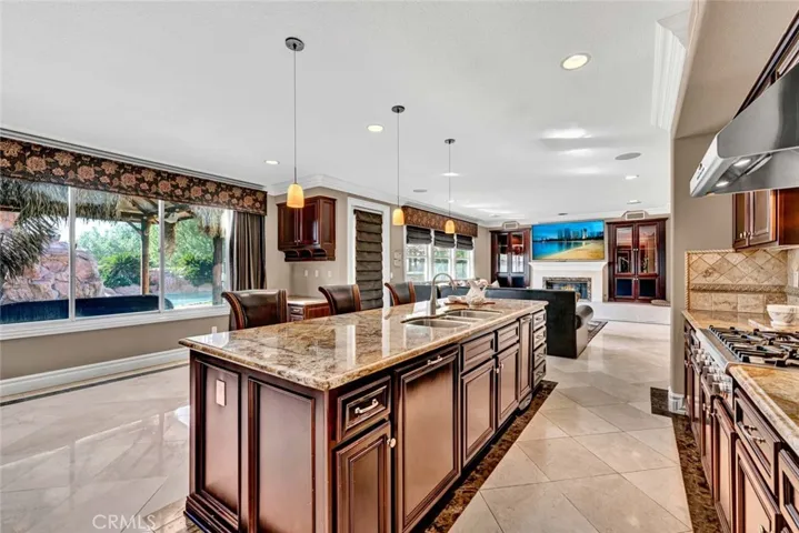 Entering the great room from the butler's pantry. The huge kitchen island is a focal point.