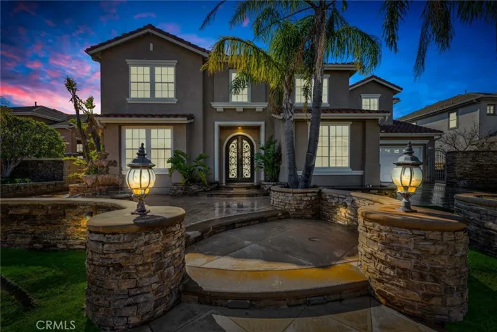 The statement this home makes starts at the guard gated entrance to the community and shows in the beautifully landscaped front yard.