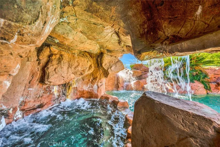 And through the doorway is a second spa behind the waterfall. Doesn't this look like a wonderful place to sit and relax?
