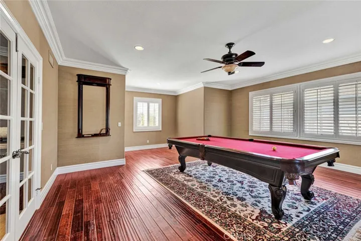 This enormous bonus room has ample space for billiards, a game table. lounging and watching a game. Or if it suits your needs better, it could be an additional bedroom or 2.