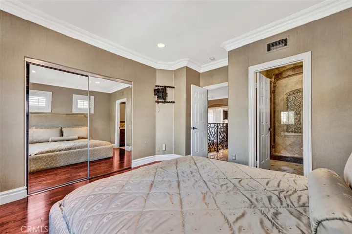 In this view you can see the private bath to the right, the entry door just to the left of that and the mirrored wardrobe closet further to the left.