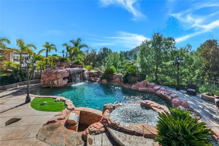 This view of the pool shows the beautiful rock waterfall that hides a surprise inside!