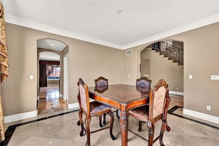 A closer look at the dining room shows you have plenty of space for 2 or more china hutches and ample seating for family and friends.