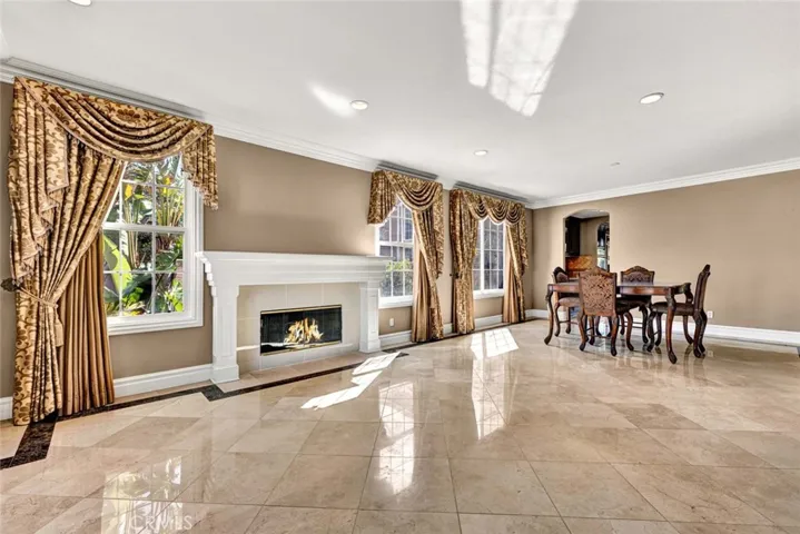 This beautiful stone flooring is found througout most of the home. Also note the custom mill work with the stately crown molding, tall baseboard and door and window casings.