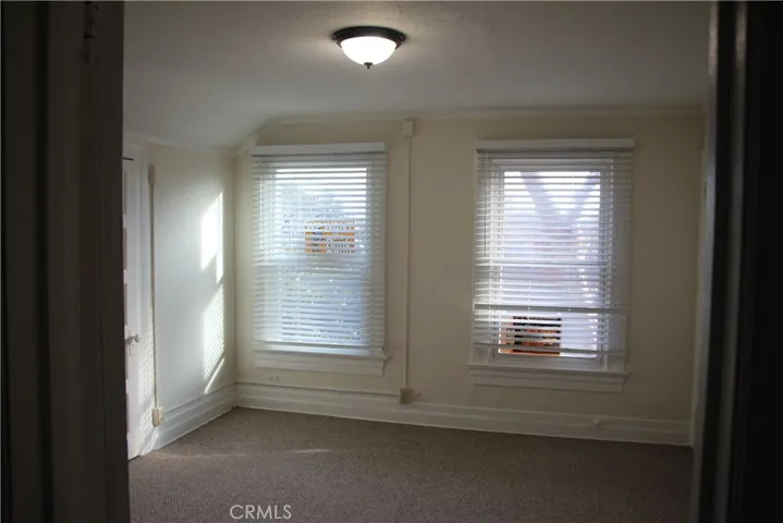 Duel windows in bedroom.