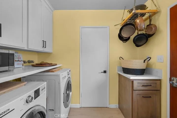 Laundry room with cabinet space