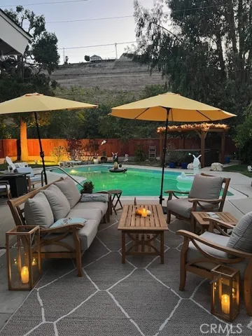 Seating around pool area, lots of ambient light to create a warm environment