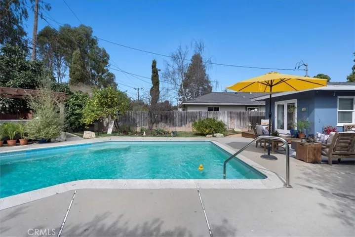 Fenced in HUGE backyard with lawn, pool and deck