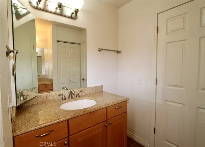 Main bathroom with dual sinks and counters