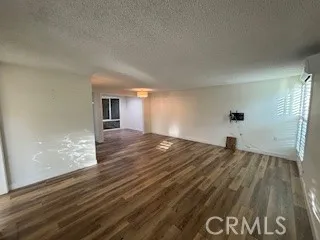 Entry into living room, atrium dining to left