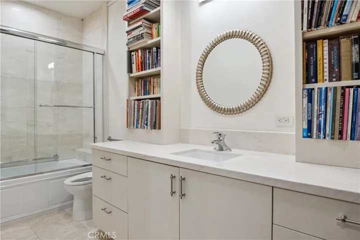 Full bath with tub and built-ins