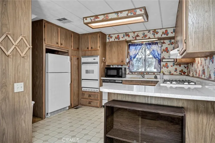 Kitchen opens to dining room