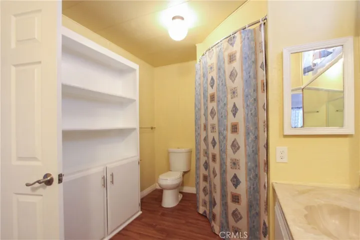 Bathroom View 1. Storage area for linens and toiletries.