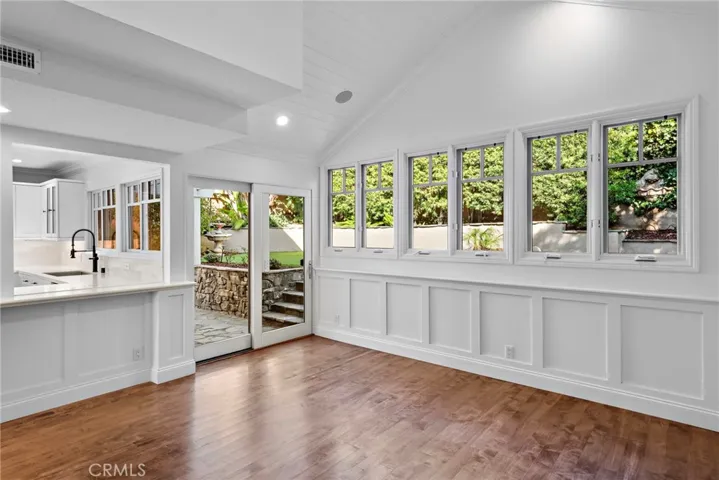 Large bank of windows draws in natural light while still allowing for ample privacy.