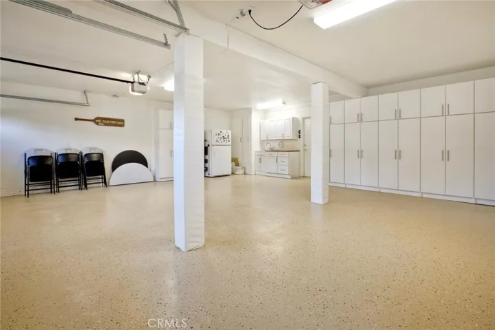 3 car garage with new epoxy and plenty of storage