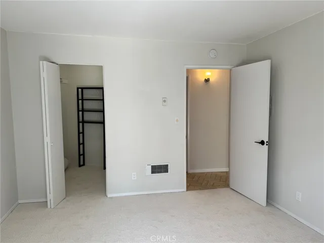 Bedroom with patio door to the balcony.