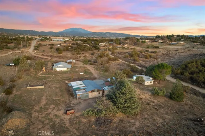 aerial view of both homes and building