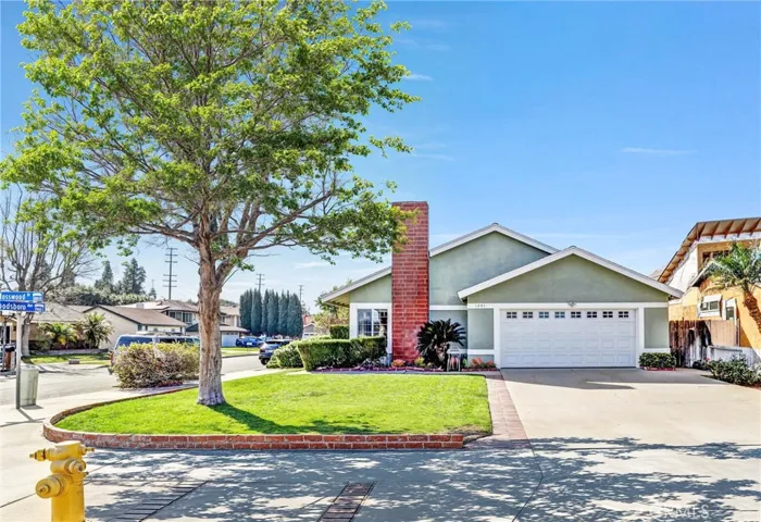 Front of 1201 N Mosswood Anaheim Hills Ca 92807 Virtual leaves added to front yard tree
