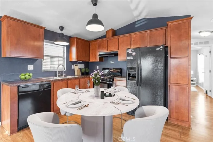 Kitchen
A well-equipped kitchen with upgraded black appliances, including a refrigerator, dishwasher, and range. The compact yet functional layout provides ample counter space and modern cabinetry for storage. Room photos has been online staged.