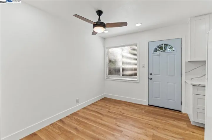 Rear view of upstaged  Dinging area.                        With all new ceiling fan.