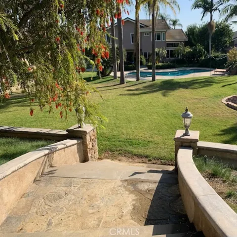 Stairway leading to backyard, notice the accents of lighting