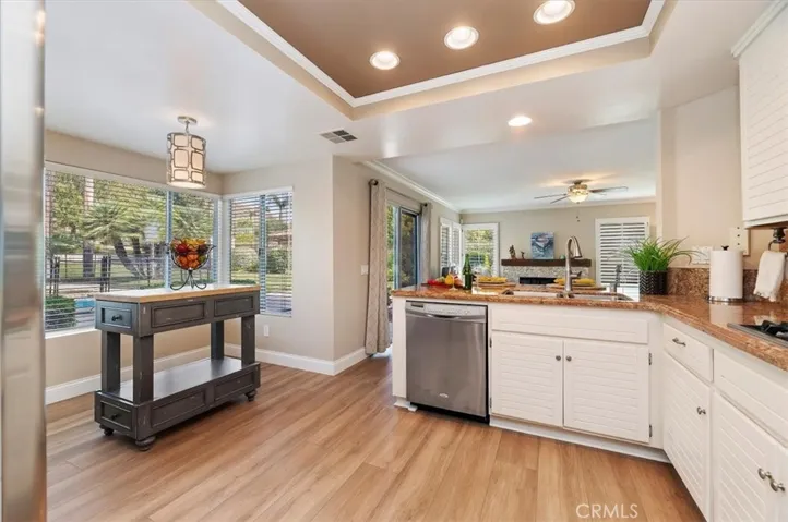 View of the breakfast nook area, notice the windows over looking the backyard and pool and spa area. The kitchen is also open to the family room, perfect for family gatherings and entertaining.
